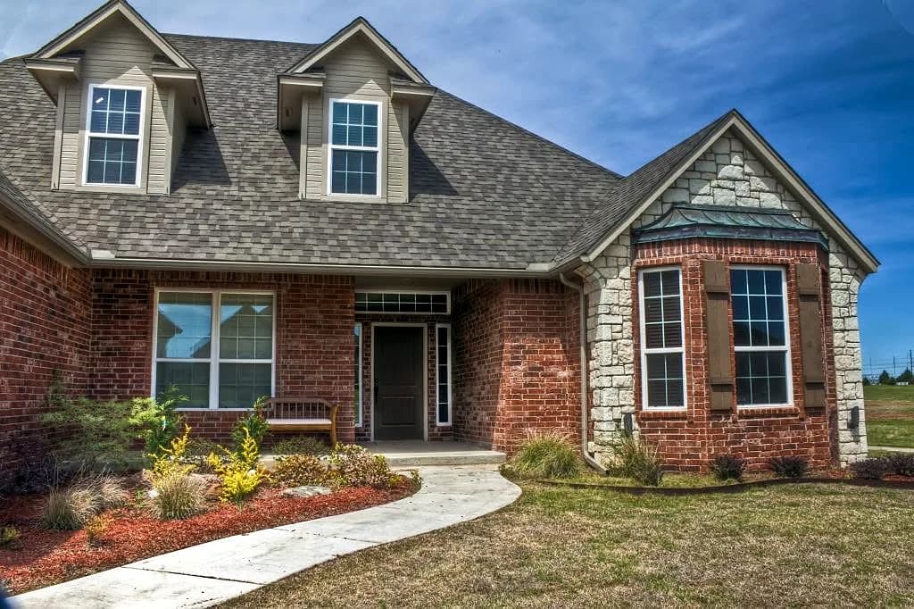Completed residential exterior and gray shingle roof project